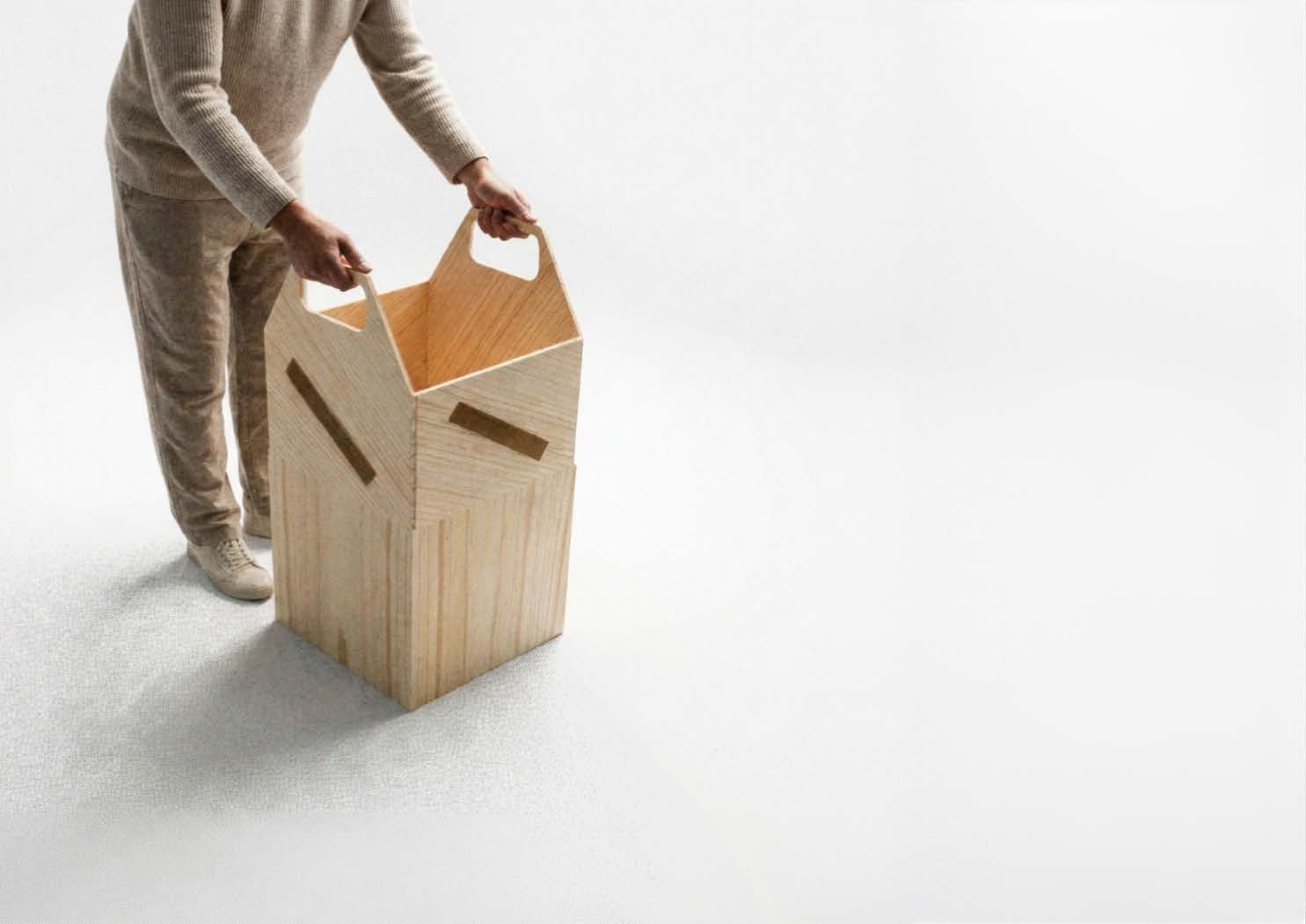 Plywood household product with flexible leather handles.